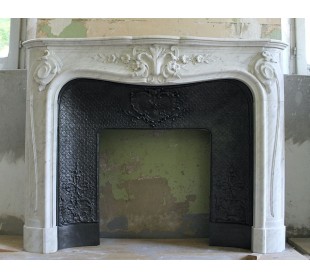 Wonderful fireplace mantel with floral carvings in white Carrara marble. This fireplace is signed by Majorelle.