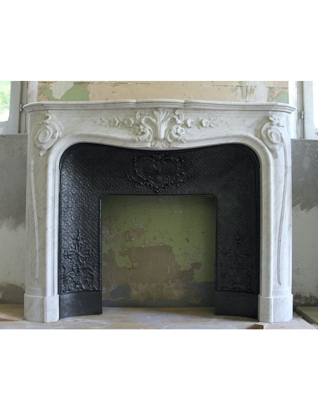 Wonderful fireplace mantel with floral carvings in white Carrara marble. This fireplace is signed by Majorelle.