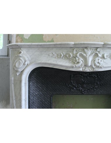 Wonderful fireplace mantel with floral carvings in white Carrara marble. This fireplace is signed by Majorelle.