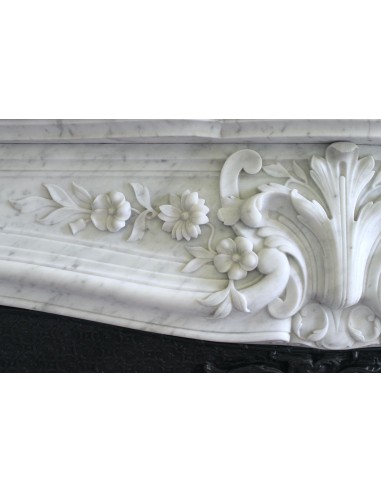 Wonderful fireplace mantel with floral carvings in white Carrara marble. This fireplace is signed by Majorelle.