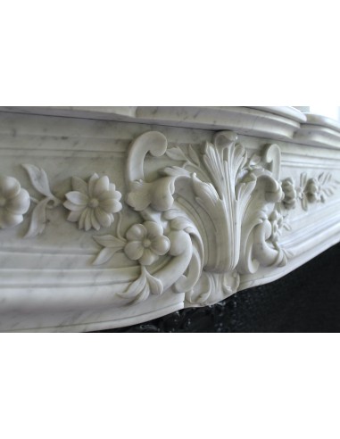 Wonderful fireplace mantel with floral carvings in white Carrara marble. This fireplace is signed by Majorelle.
