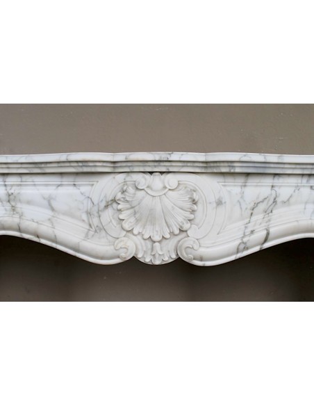 Antique Louis XV "Trois Coquilles Amélioré" fireplace mantel carved in veined White Calacatta marble. A rare and elegant mantel.