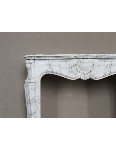 Antique Louis XV "Trois Coquilles Amélioré" fireplace mantel carved in veined White Calacatta marble. A rare and elegant mantel.