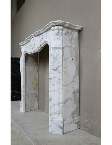Antique Louis XV "Trois Coquilles Amélioré" fireplace mantel carved in veined White Calacatta marble. A rare and elegant mantel.