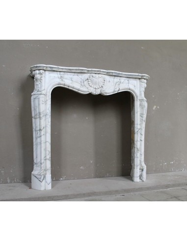 Antique Louis XV "Trois Coquilles Amélioré" fireplace mantel carved in veined White Calacatta marble. A rare and elegant mantel.