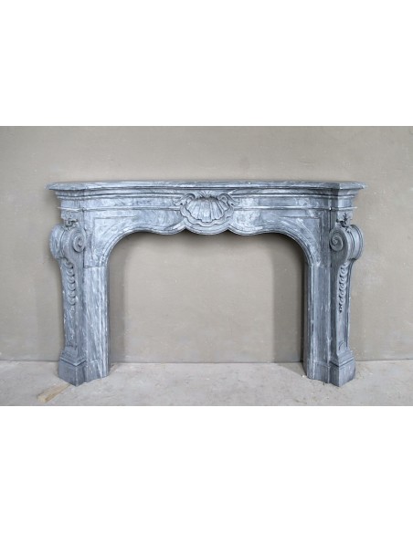 Important antique Italian Baroque fireplace in Gray Blue marble. This antique marble mantel is a truly unique piece.