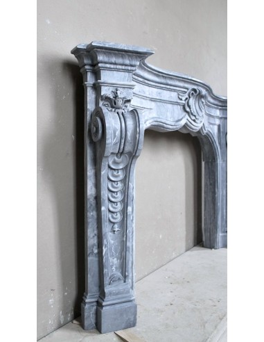 Important antique Italian Baroque fireplace in Gray Blue marble. This antique marble mantel is a truly unique piece.