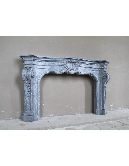 Important antique Italian Baroque fireplace in Gray Blue marble. This antique marble mantel is a truly unique piece.