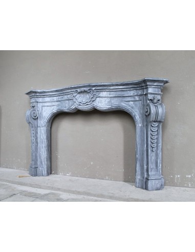 Important antique Italian Baroque fireplace in Gray Blue marble. This antique marble mantel is a truly unique piece.