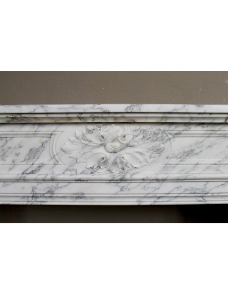 Neoclassical fire surround in Statuary Arabescato marble featuring soft gray veins on a white background.