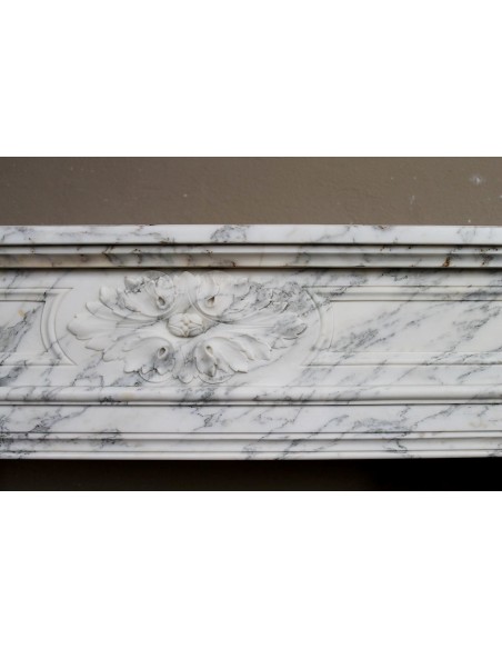 Neoclassical fire surround in Statuary Arabescato marble featuring soft gray veins on a white background.