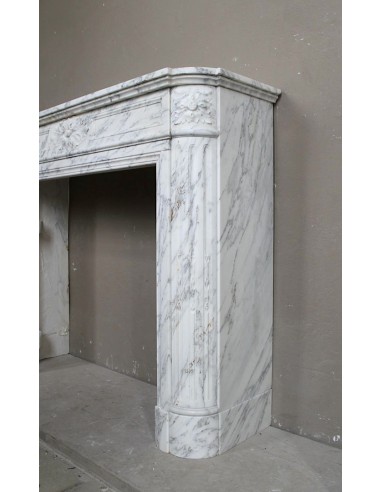 Neoclassical fire surround in Statuary Arabescato marble featuring soft gray veins on a white background.