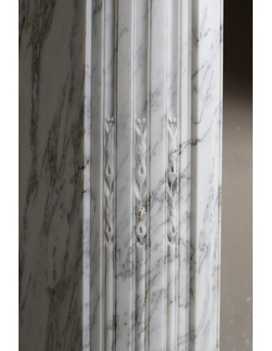 Neoclassical fire surround in Statuary Arabescato marble featuring soft gray veins on a white background.