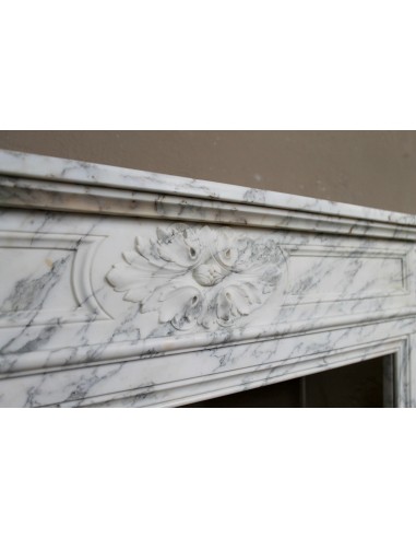Neoclassical fire surround in Statuary Arabescato marble featuring soft gray veins on a white background.
