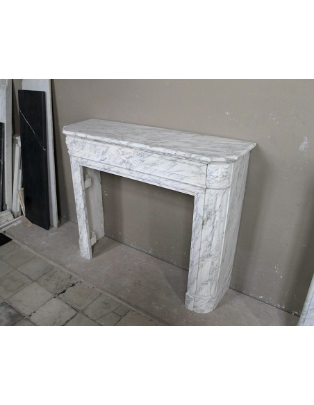 Neoclassical fire surround in Statuary Arabescato marble featuring soft gray veins on a white background.
