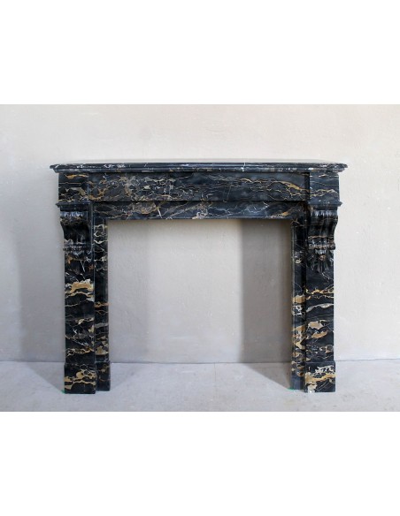 Antique Louis Philippe-style "Palmettes" fireplace mantel, carved in the very rare Black Portoro "Gold" marble.