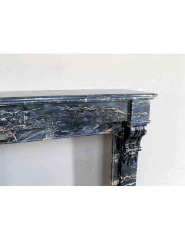 Antique Louis Philippe-style "Palmettes" fireplace mantel, carved in the very rare Black Portoro "Gold" marble.