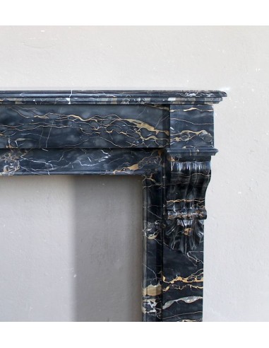 Antique Louis Philippe-style "Palmettes" fireplace mantel, carved in the very rare Black Portoro "Gold" marble.