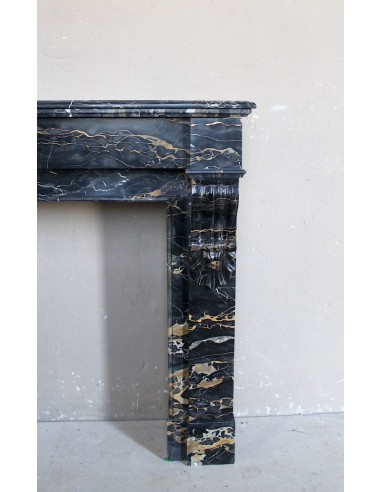 Antique Louis Philippe-style "Palmettes" fireplace mantel, carved in the very rare Black Portoro "Gold" marble.