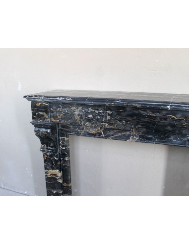 Antique Louis Philippe-style "Palmettes" fireplace mantel, carved in the very rare Black Portoro "Gold" marble.