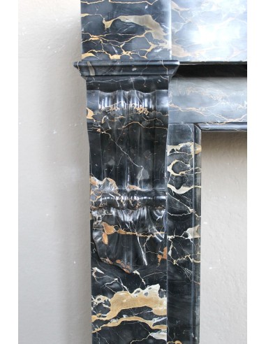 Antique Louis Philippe-style "Palmettes" fireplace mantel, carved in the very rare Black Portoro "Gold" marble.