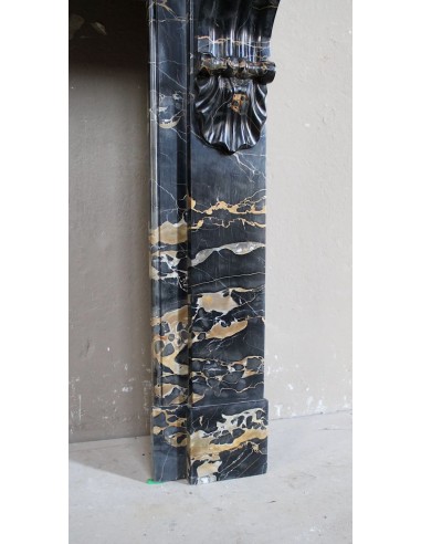 Antique Louis Philippe-style "Palmettes" fireplace mantel, carved in the very rare Black Portoro "Gold" marble.