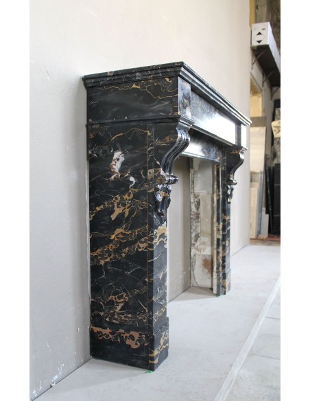 Antique Louis Philippe-style "Palmettes" fireplace mantel, carved in the very rare Black Portoro "Gold" marble.