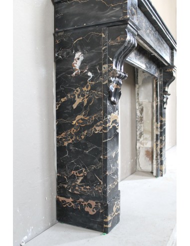 Antique Louis Philippe-style "Palmettes" fireplace mantel, carved in the very rare Black Portoro "Gold" marble.