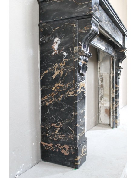 Antique Louis Philippe-style "Palmettes" fireplace mantel, carved in the very rare Black Portoro "Gold" marble.