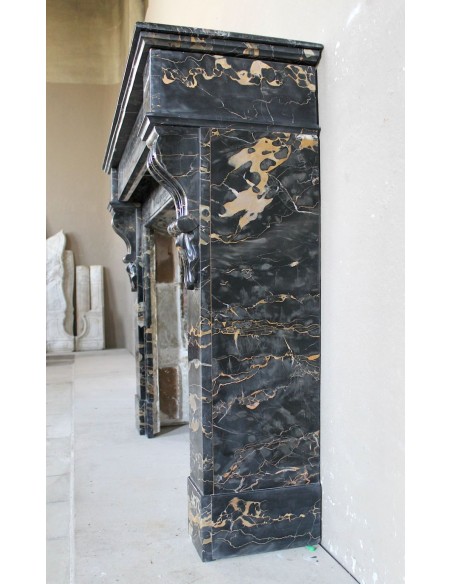 Antique Louis Philippe-style "Palmettes" fireplace mantel, carved in the very rare Black Portoro "Gold" marble.