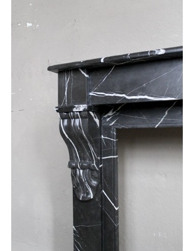 Antique Louis Philippe "Palmettes" fireplace mantel in stunning Black Marquinia marble, with very fine white veins.