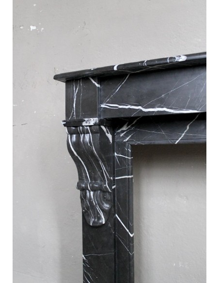 Antique Louis Philippe "Palmettes" fireplace mantel in stunning Black Marquinia marble, with very fine white veins.