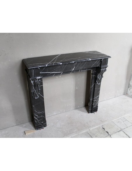Antique Louis Philippe "Palmettes" fireplace mantel in stunning Black Marquinia marble, with very fine white veins.