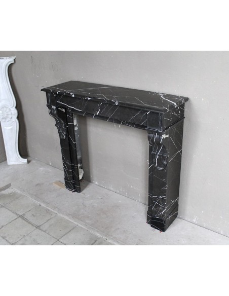 Antique Louis Philippe "Palmettes" fireplace mantel in stunning Black Marquinia marble, with very fine white veins.