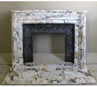 Exceptional antique Neoclassical-style fireplace mantel with fine floral carvings in stunning Italian Calacatta Gold marble.