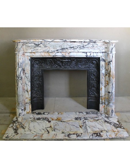 Exceptional antique Neoclassical-style fireplace mantel with fine floral carvings in stunning Italian Calacatta Gold marble.