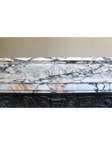Exceptional antique Neoclassical-style fireplace mantel with fine floral carvings in stunning Italian Calacatta Gold marble.