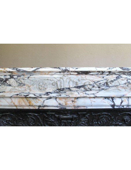 Exceptional antique Neoclassical-style fireplace mantel with fine floral carvings in stunning Italian Calacatta Gold marble.