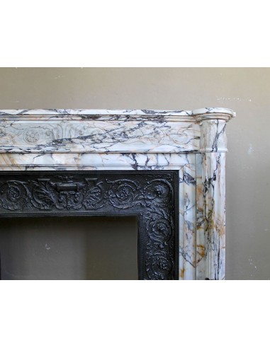 Exceptional antique Neoclassical-style fireplace mantel with fine floral carvings in stunning Italian Calacatta Gold marble.