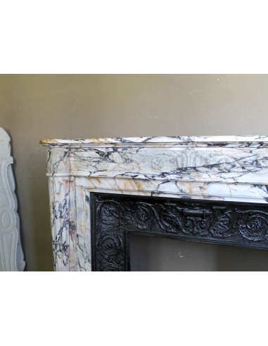 Exceptional antique Neoclassical-style fireplace mantel with fine floral carvings in stunning Italian Calacatta Gold marble.