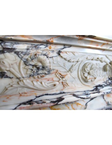 Exceptional antique Neoclassical-style fireplace mantel with fine floral carvings in stunning Italian Calacatta Gold marble.