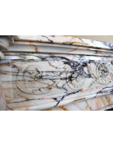 Exceptional antique Neoclassical-style fireplace mantel with fine floral carvings in stunning Italian Calacatta Gold marble.