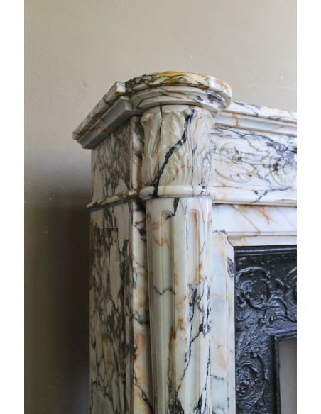 Exceptional antique Neoclassical-style fireplace mantel with fine floral carvings in stunning Italian Calacatta Gold marble.