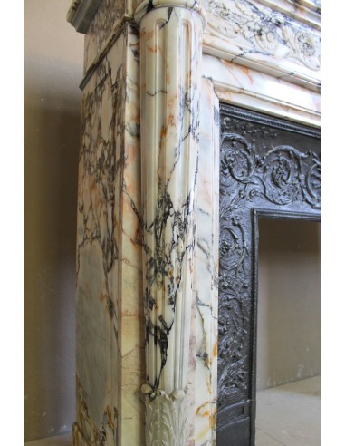 Exceptional antique Neoclassical-style fireplace mantel with fine floral carvings in stunning Italian Calacatta Gold marble.