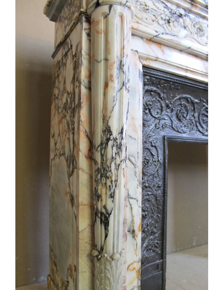Exceptional antique Neoclassical-style fireplace mantel with fine floral carvings in stunning Italian Calacatta Gold marble.
