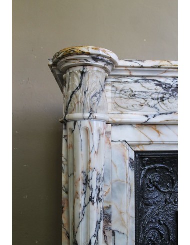 Exceptional antique Neoclassical-style fireplace mantel with fine floral carvings in stunning Italian Calacatta Gold marble.