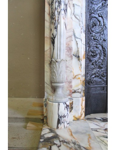 Exceptional antique Neoclassical-style fireplace mantel with fine floral carvings in stunning Italian Calacatta Gold marble.