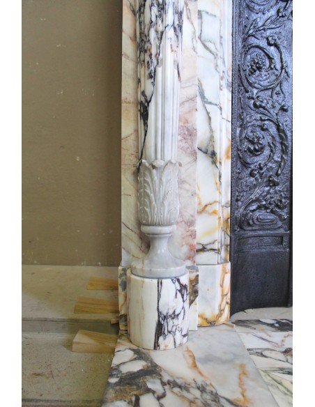 Exceptional antique Neoclassical-style fireplace mantel with fine floral carvings in stunning Italian Calacatta Gold marble.