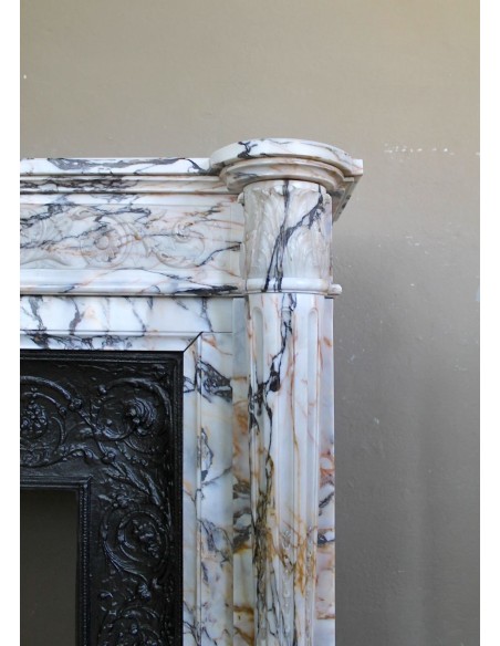 Exceptional antique Neoclassical-style fireplace mantel with fine floral carvings in stunning Italian Calacatta Gold marble.