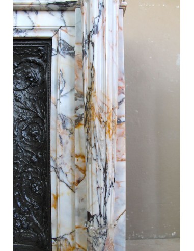 Exceptional antique Neoclassical-style fireplace mantel with fine floral carvings in stunning Italian Calacatta Gold marble.